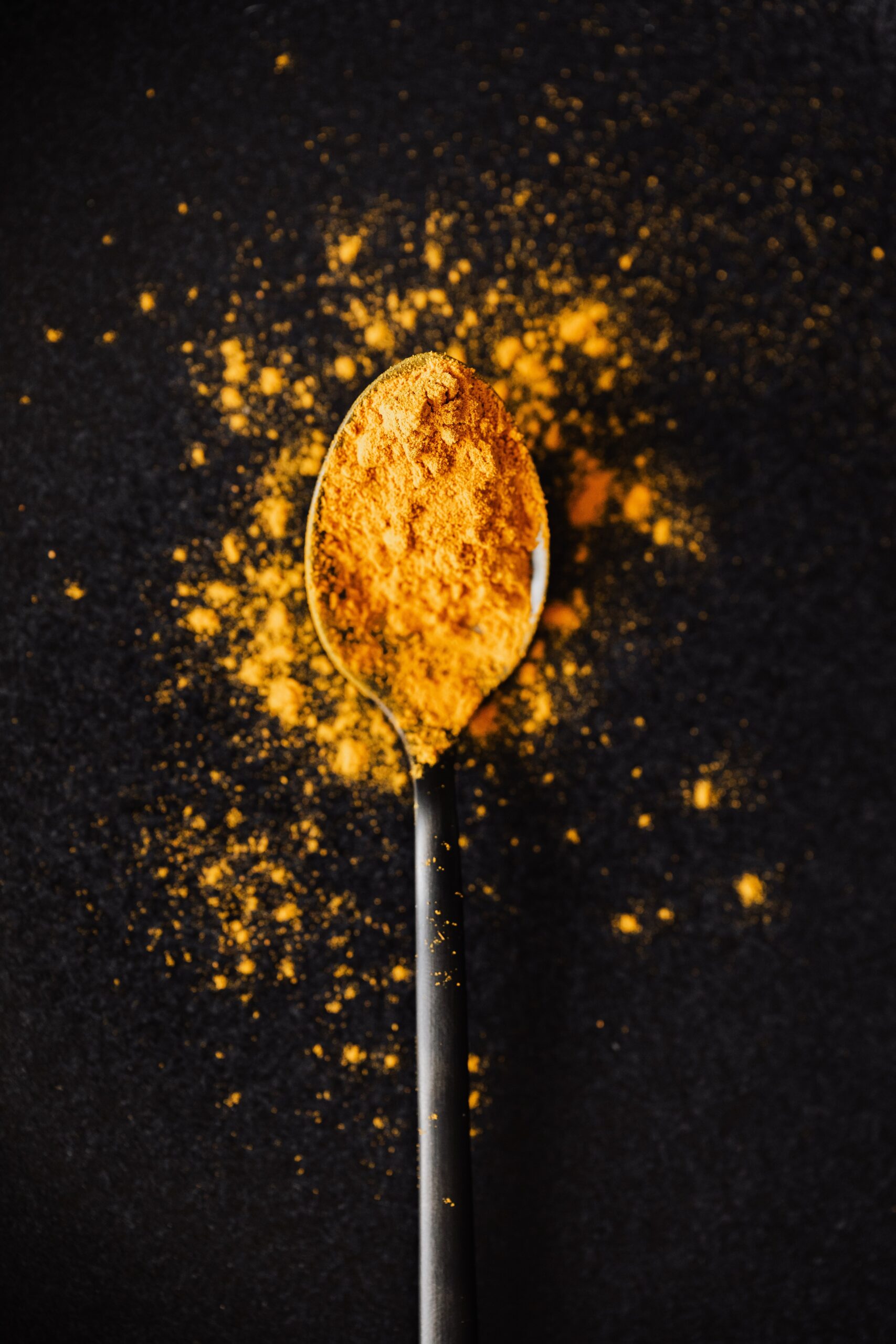 Turmeric powder in a spoon
