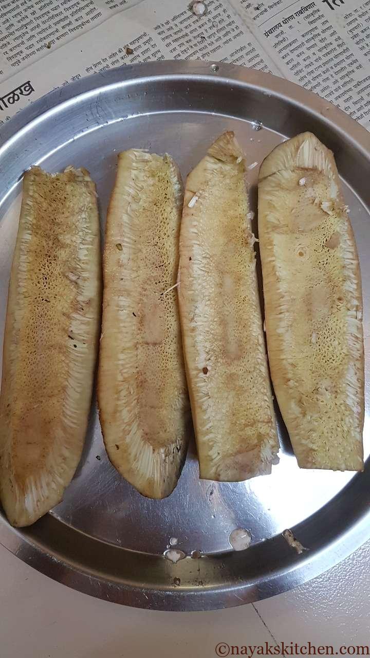 Cut the raw jackfruit into quarters