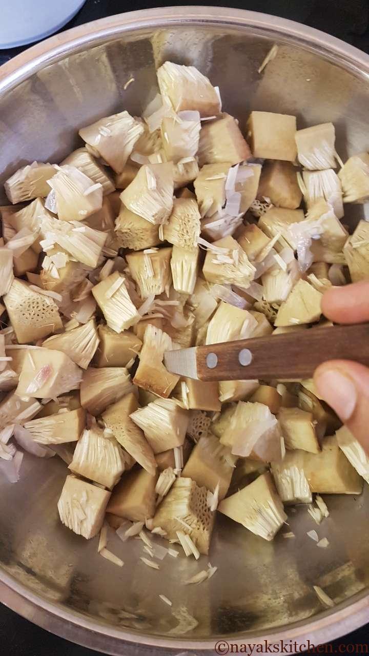 Checking if jackfruit pieces have cooked