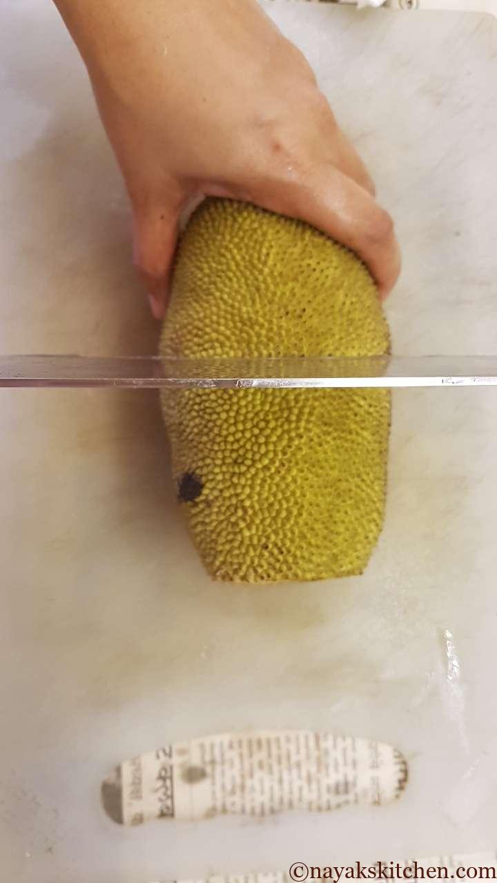 Cut the raw jackfruit into 2 halves