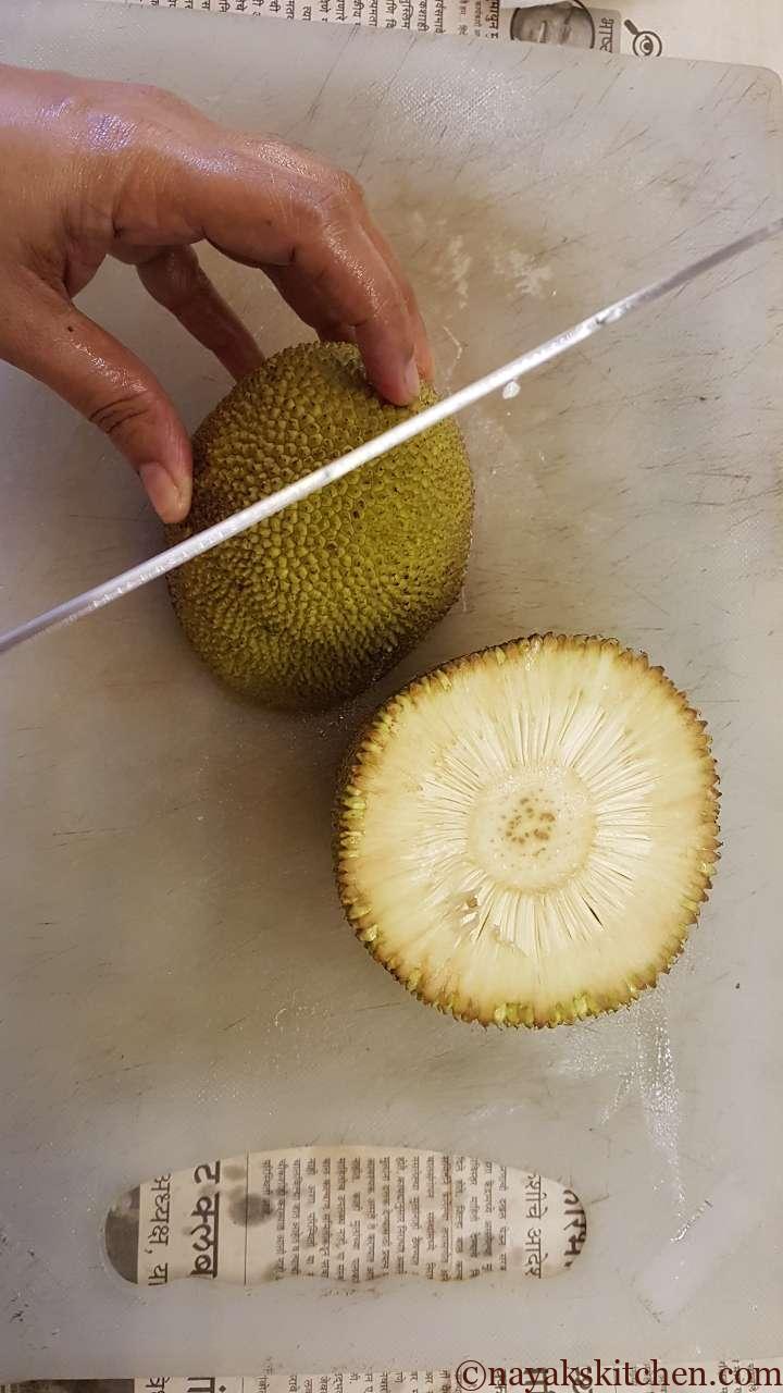 Cutting the raw jackfruit into quarters