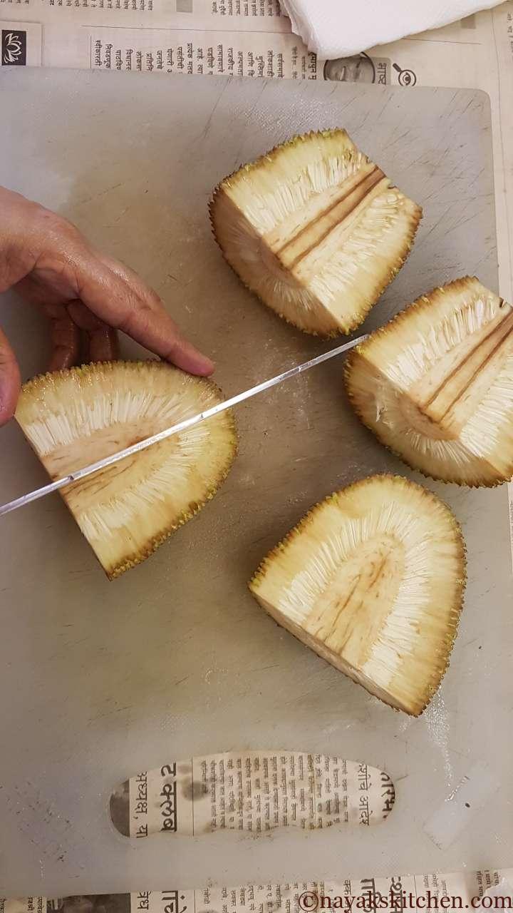 Cutting the quartered jackfruit further