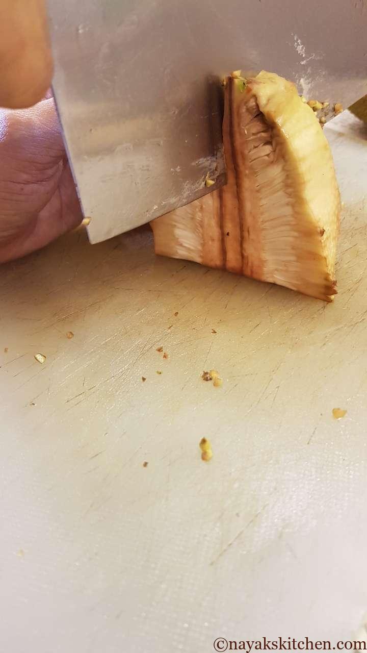 Cutting the raw jackfruit from the centre