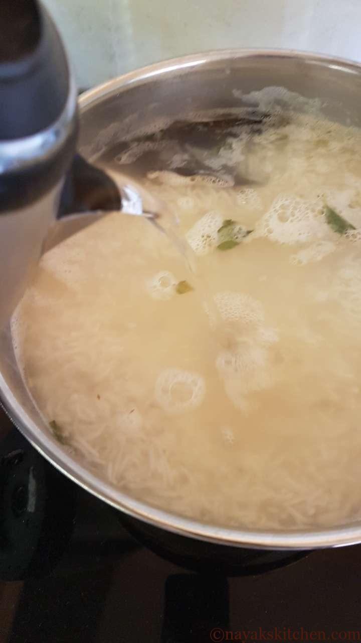 Adding hot water to boiling rice if needed
