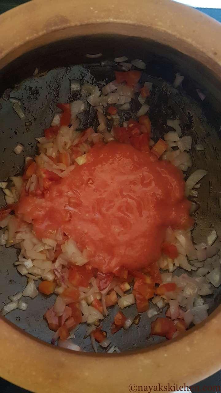 Adding tomato puree
