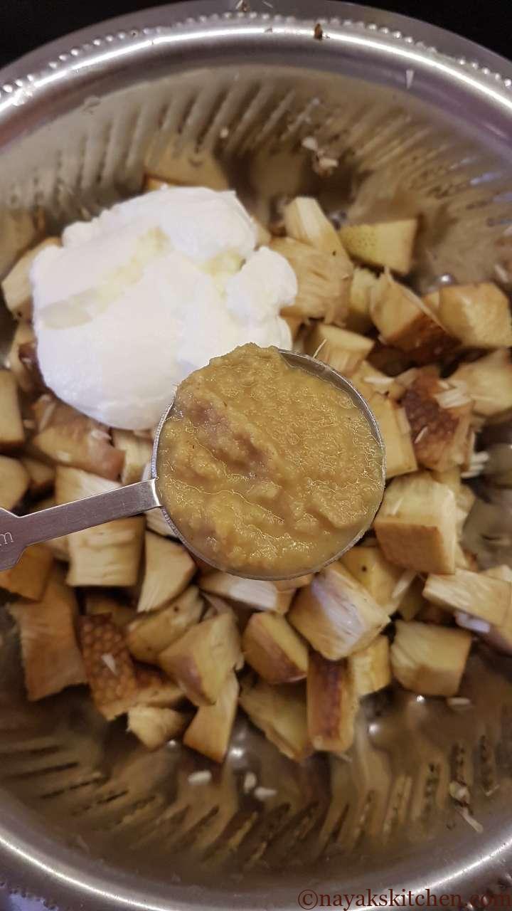 Adding ginger-garlic paste to jackfruit pieces