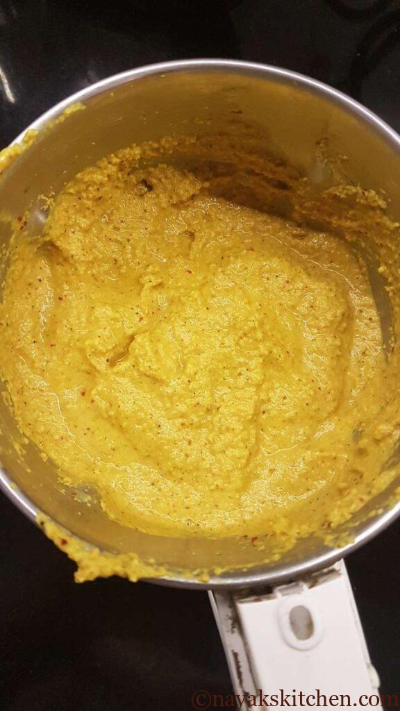 Grinding the mixture to a fine paste