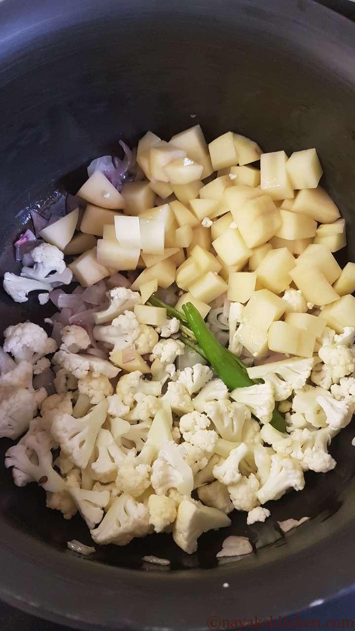 Add potato, cauliflower and slit green chilli
