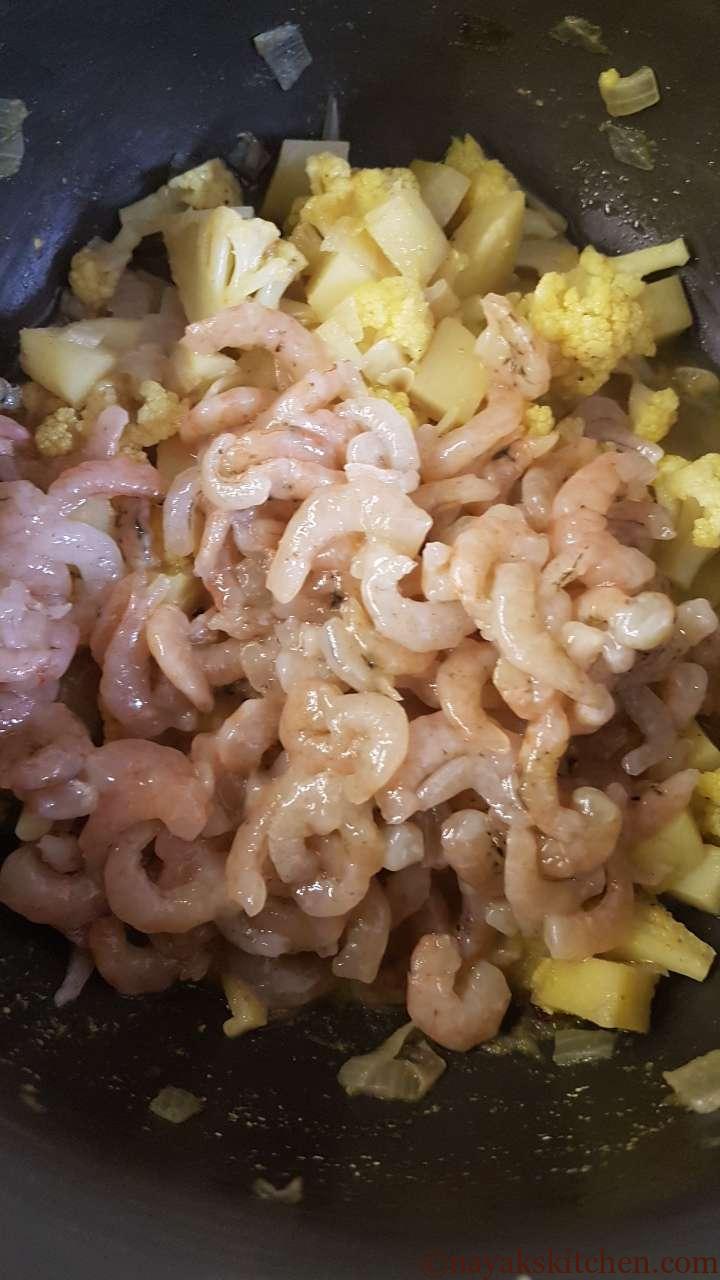 Add prawns to cooked veggies