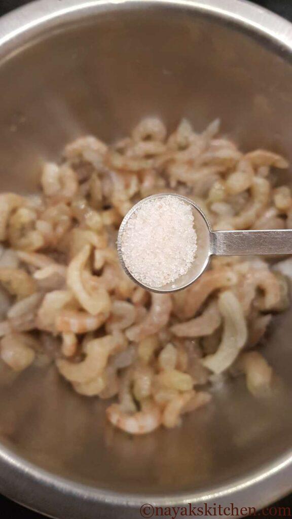 Adding salt to prawns