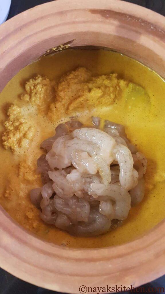 Adding prawns to spicy prawn curry